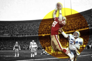 football player jumping to catch a pass